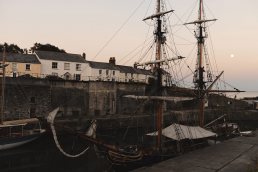 old sailing boat in the harbour in sunset