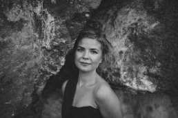 black and white women portrait with rock