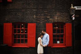London engagement photography with red coloured window